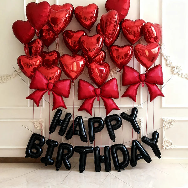 A display of 29 red heart-shaped balloons arranged in a festive cluster.