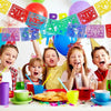 A group of happy children celebrating with a colorful papel picado bunting banner and balloons.