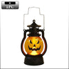 A black pumpkin lantern with an orange glow and a carved jack-o'-lantern face inside.