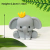 A gray elephant figure with a yellow crown, shown against a green background.