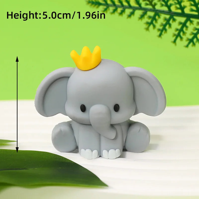 A gray elephant figure with a yellow crown, shown against a green background.