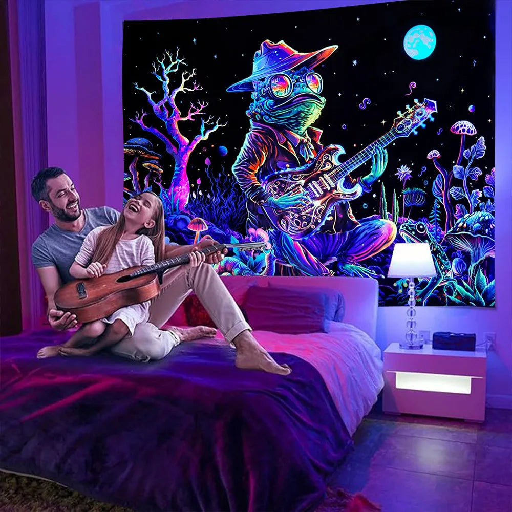 A couple posing in a bedroom with a large canvas featuring a psychedelic alien guitar character against a dark background.