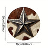 A vintage western cowboy star metal sign with a brown and white cow print background.