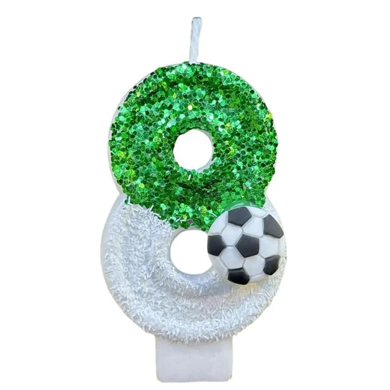 A custom birthday candle shaped like the number 0, covered in green glitter, mounted on a white base.