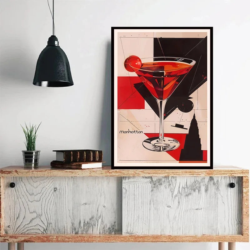 A framed canvas print featuring a vibrant red cocktail glass against a black and white background.