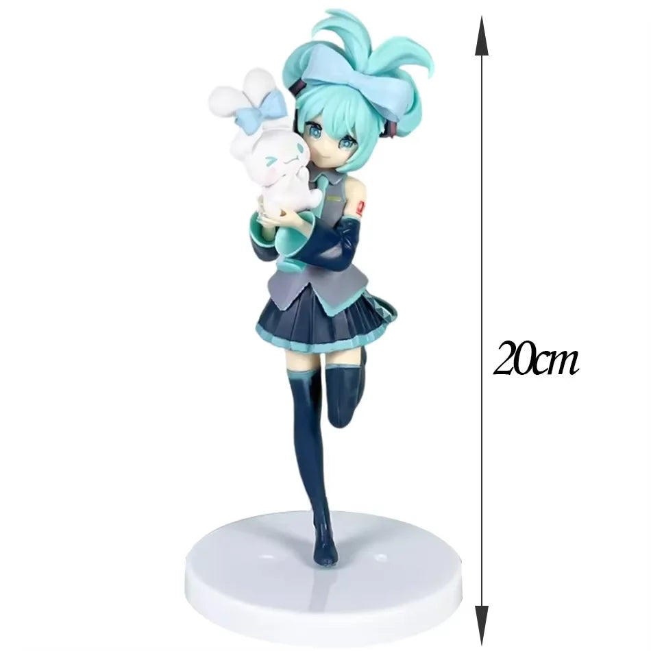 A stylized action figure doll of Hatsune Miku in a Gothic Lolita outfit holding a white fairy accessory.