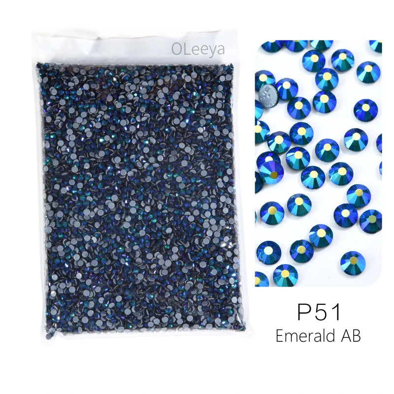 A sheet of dark blue crystal and crystal AB glass rhinestones for crafting projects.