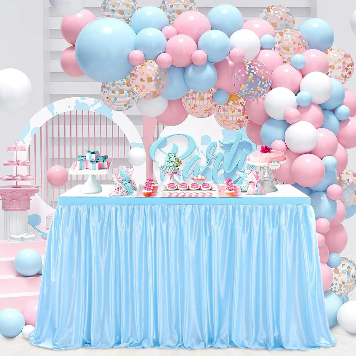 Light blue pleated polyester table skirt used for a party decoration setup with pink and blue balloons.