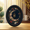 Dark blue wall art featuring a detailed crescent moon and floral design in gold and deep red tones.