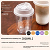 A pack of 10 clear disposable drinking cups with lids shown next to a white cup.