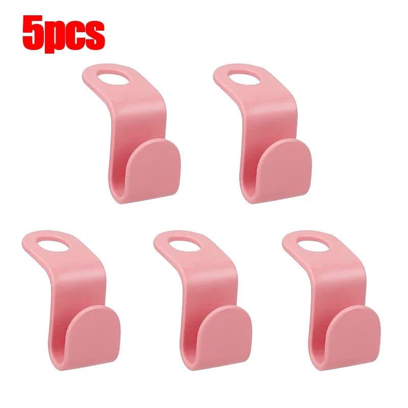 Five pink space-saving hanger connector hooks for organizing and storage.