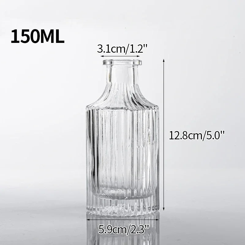 A clear glass vase with ribbed texture, measuring 150ml, shown in a vertical view.