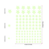 A grid of light green glow-in-the-dark star wall decals with various sizes displayed against a measurement scale.
