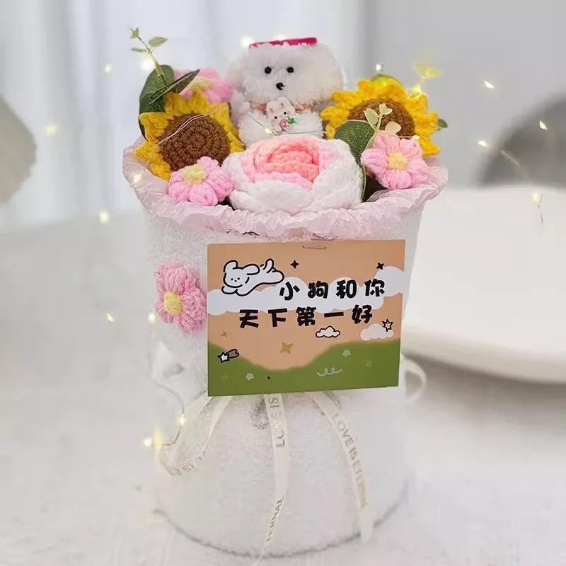 A handmade crochet flower bouquet featuring pink and yellow flowers with a white fluffy animal centerpiece