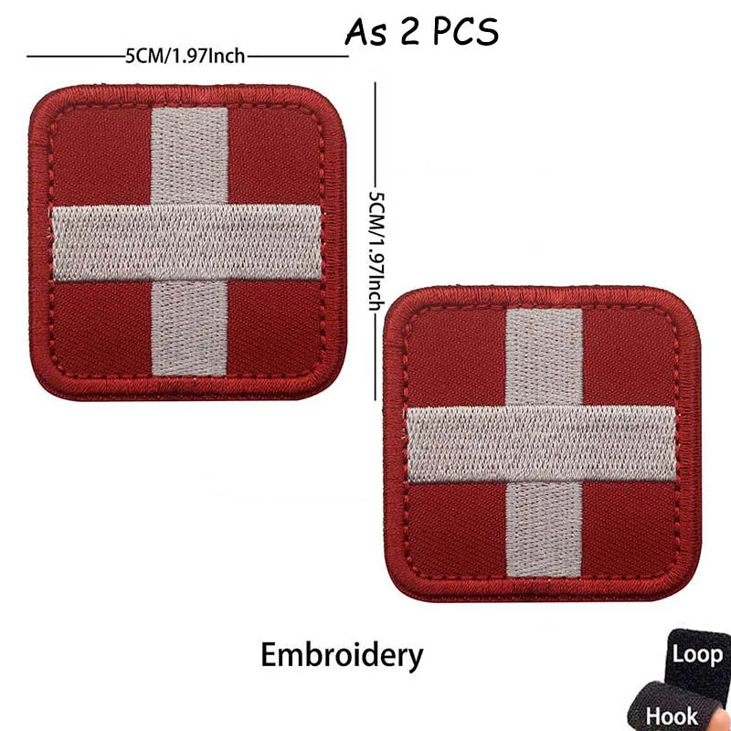 Two red and gray embroidered cross tactical morale patches with loop and hook