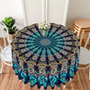 Bohemian peacock mandala round tablecloth featuring blue and teal patterns on a table.