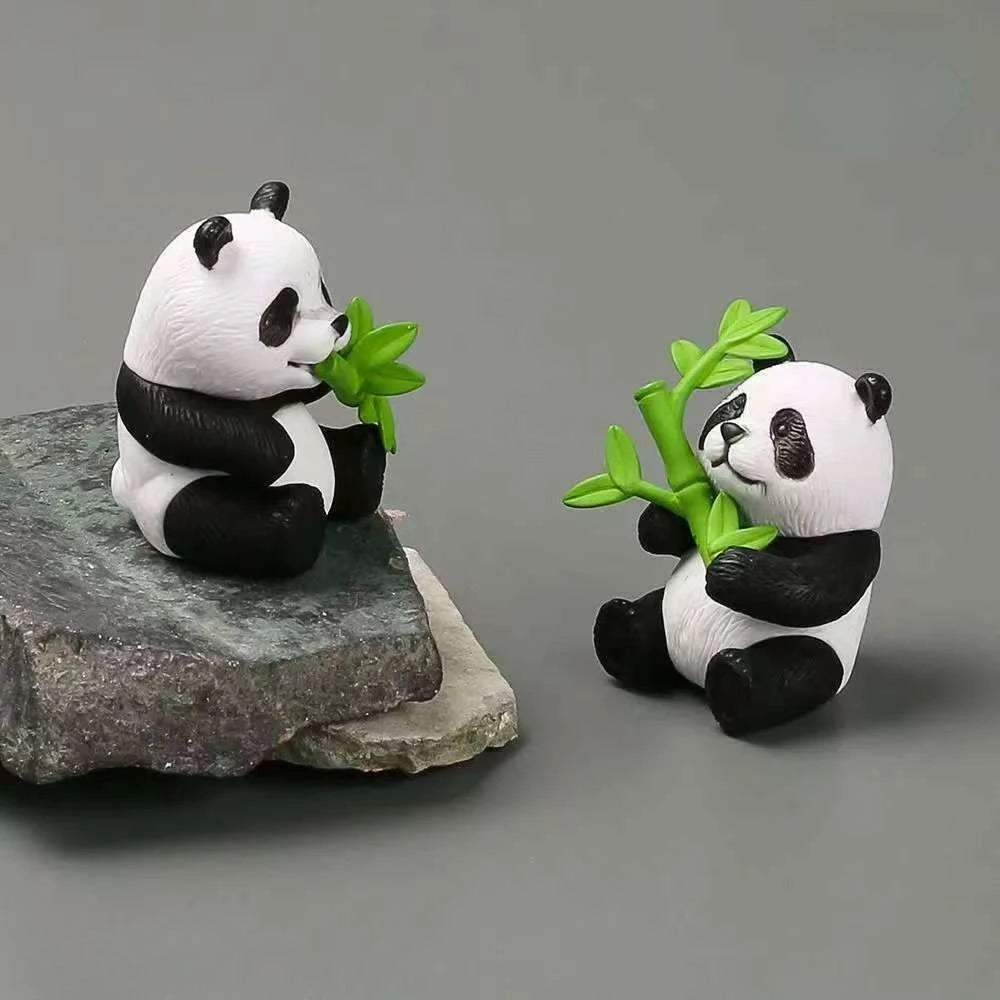 A set of mini resin panda bonsai figurines, one holding a green leaf.
