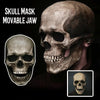 A realistic full-head skull mask with a movable jaw shown in close-up against a dark background.