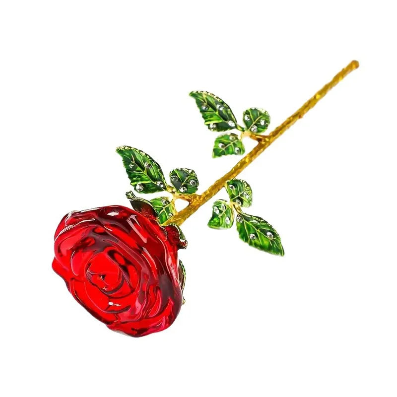 A crystal glass rose flower branch with green leaves and a red rose bloom.