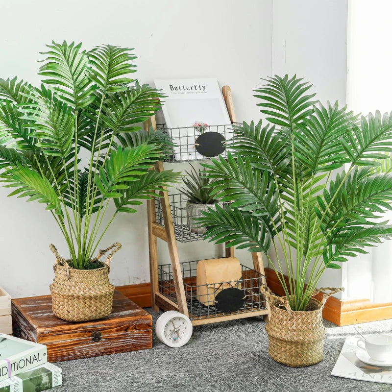 Artificial Areca Palm Tree with long green fronds in a woven pot displayed on a wooden surface.