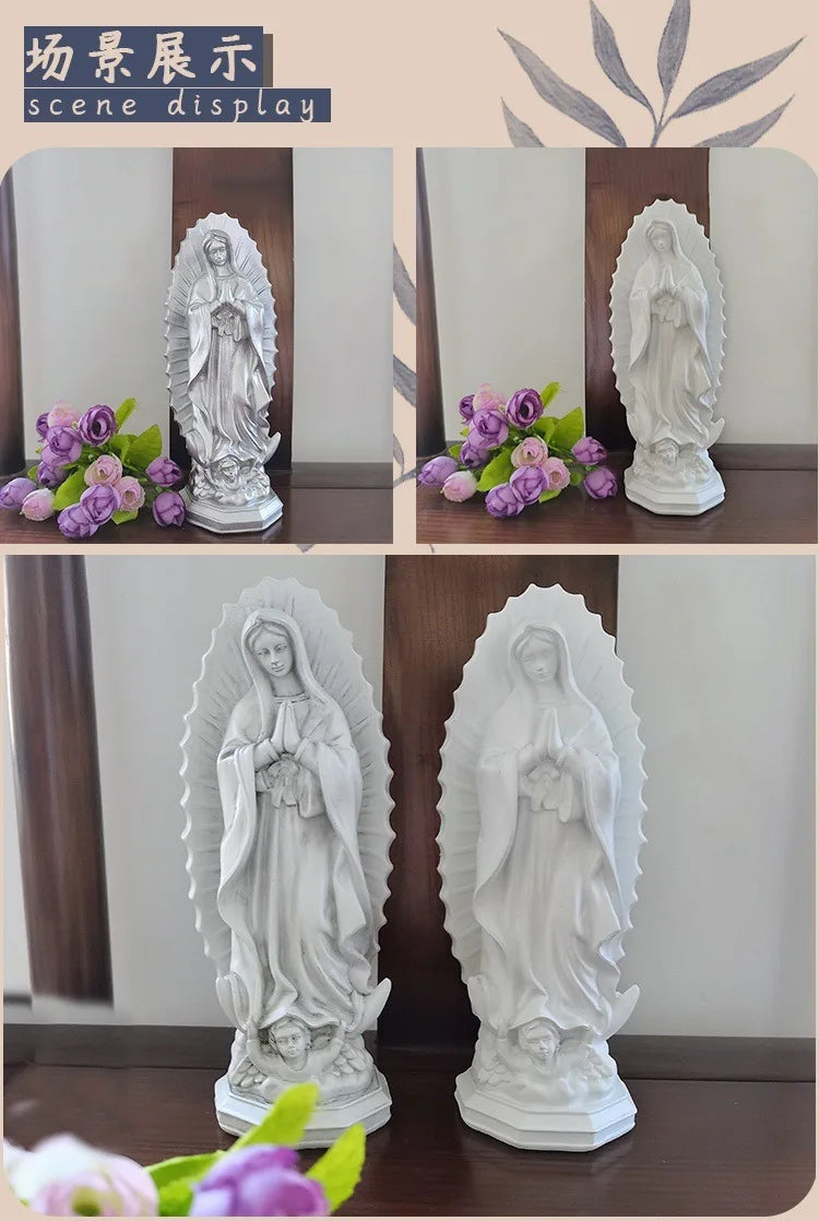 A white resin statue of Our Lady of Guadalupe with a halo, displayed on a wooden surface.