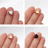 Close-up photos show heart-shaped stainless steel bead charms resting on human fingers.