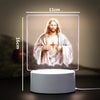 A 11cm LED night light featuring a painting of Jesus Christ with a halo and radiant light.