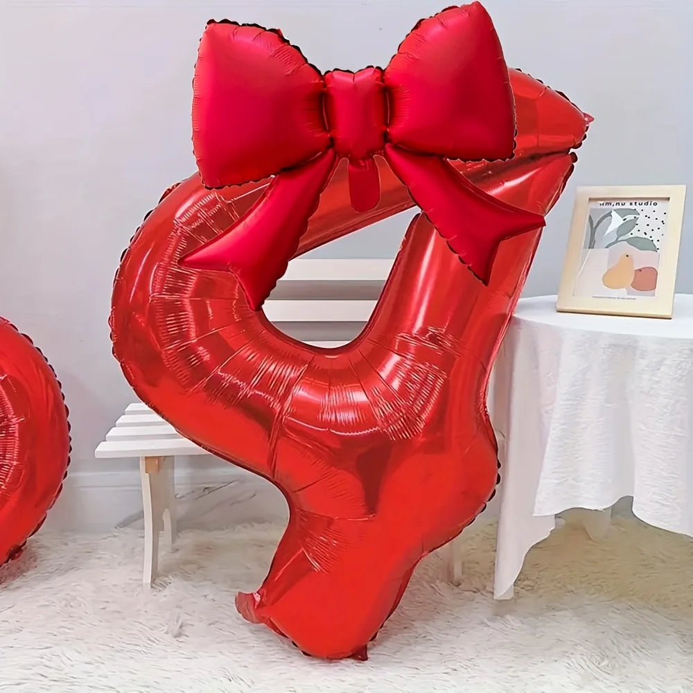 A large red foil number balloon shaped like the number 4, tied with a matching red bow.