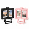 A pink and black 3D rotating photo frame set with a stand for desk display.