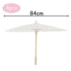 A white decorative paper parasol umbrella with a 84cm span and a light wooden pole.