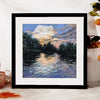 A framed oil painting depicting a sunset reflection on water with silhouetted trees and clouds.