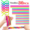 A hand is stretching a colorful noodle fidget toy, showing various bright colors like pink, green, and blue.