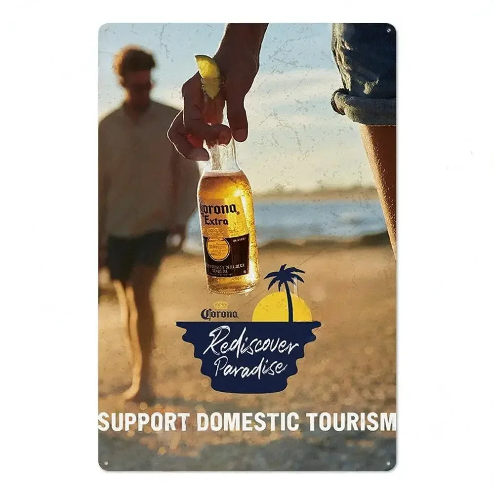 A glass of Corona Extra beer being held, with a yellow citrus garnish, set against a blurred outdoor background.