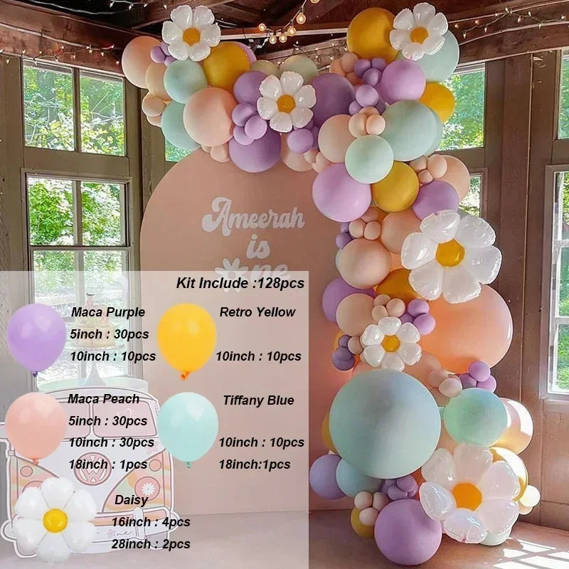 A balloon garland arch kit featuring pink, peach, yellow, and purple balloons for a celebration backdrop.