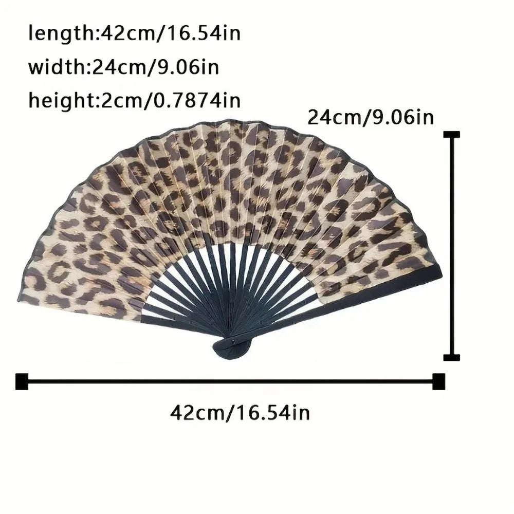 A leopard print folding hand fan shown with dimensions of 42cm long, 24cm wide, and 2cm high.