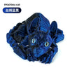 A dark blue articulated figurine of a hairless cat with large ears and expressive eyes.