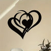 Black metal wall art featuring a stylized heart design with an inner heart silhouette on a light wall.
