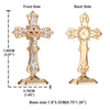 A gold-colored metal crucifix desk cross with a self-adhesive base shown from the front and back sides.