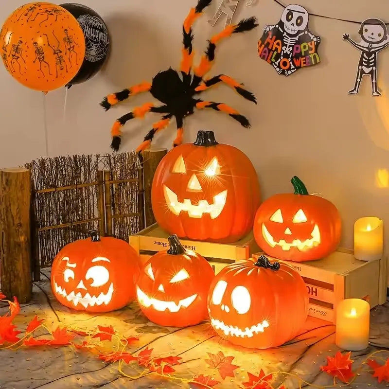 A display of glowing orange Halloween pumpkins and spooky decor, including a black spider and skeleton figures.