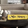 A yellow vintage retro metal street sign with black lettering that reads Bee Happy