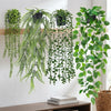 A set of four realistic hanging artificial ivy vines with green foliage displayed on a wooden shelf.