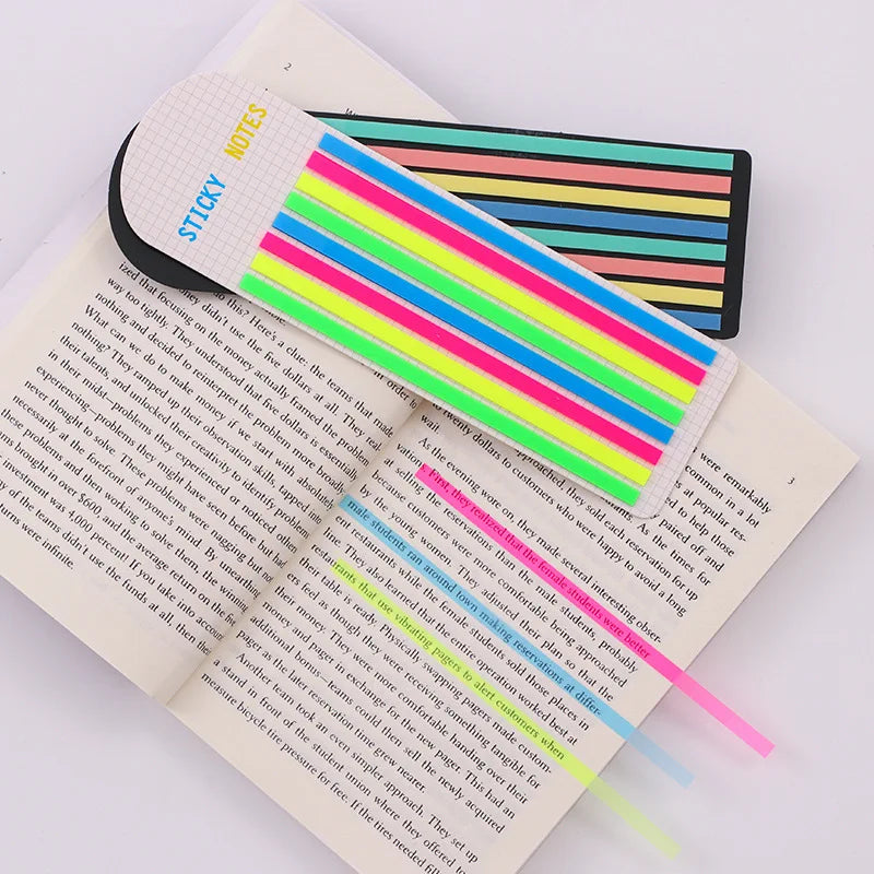A set of transparent stickers and index tabs with colorful stripes on a white page.