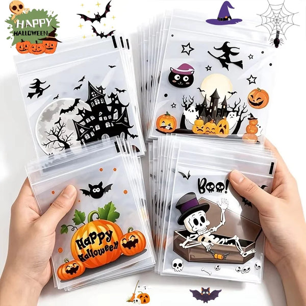A hand holds a stack of clear self-adhesive treat bags decorated with Halloween themes like bats, pumpkins, and spooky silhou
