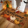 A vintage harvest pumpkin maple leaf doormat placed on a wooden floor near an entryway with seasonal decorations.