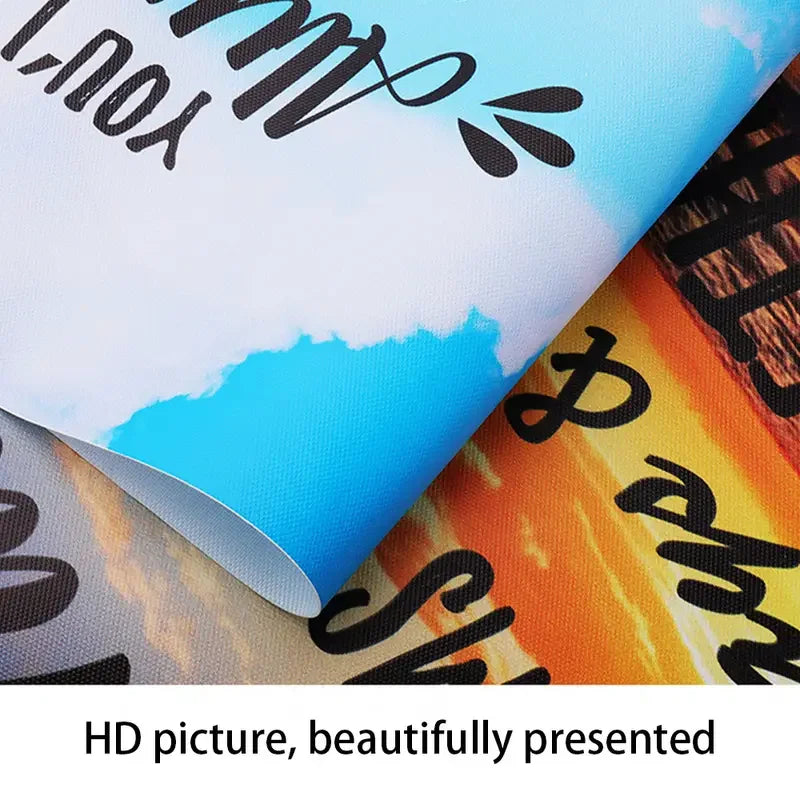 A close-up of a rolled canvas wall art featuring inspirational Bible verses with blue and orange gradients.