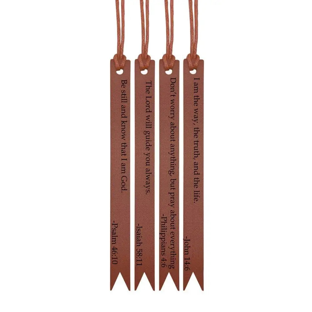 A set of brown leather bible bookmarks with engraved scripture verses hanging from a cord.