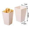 A pink disposable paper food tray filled with yellow popcorn, showing its dimensions.