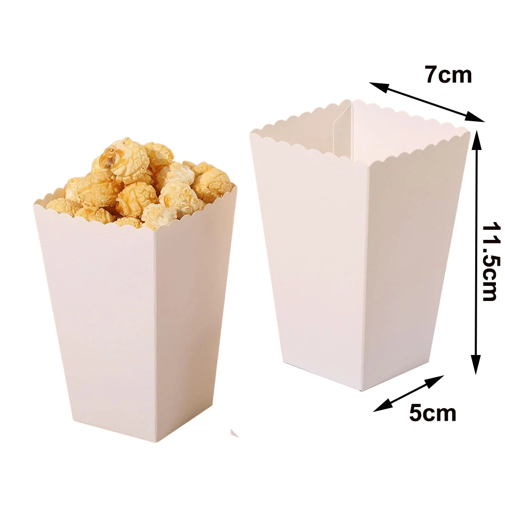 A pink disposable paper food tray filled with yellow popcorn, showing its dimensions.