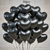 A bouquet of 30 glossy black heart-shaped latex balloons tied together.