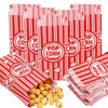 Red and white striped popcorn bags stacked and scattered, ready for parties or events.